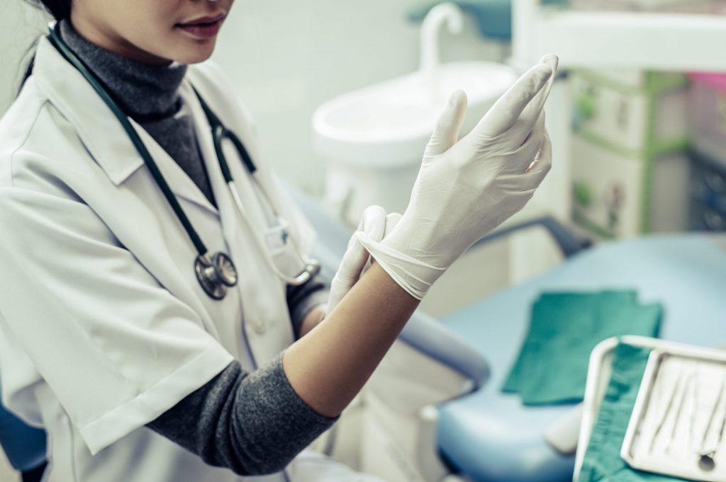 Nurse with latex gloves on